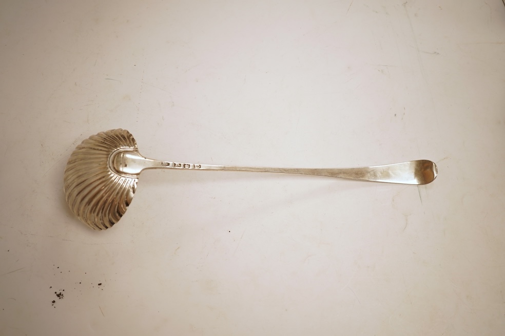 A late George II silver feather edge Old English pattern soup ladle, with fluted bowl, by Richard Rugg, London, 1759, 34cm, 5oz.